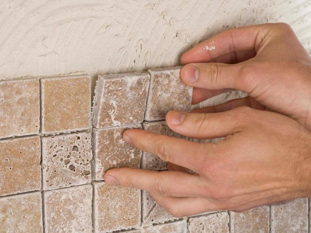 Tile backsplash being installed